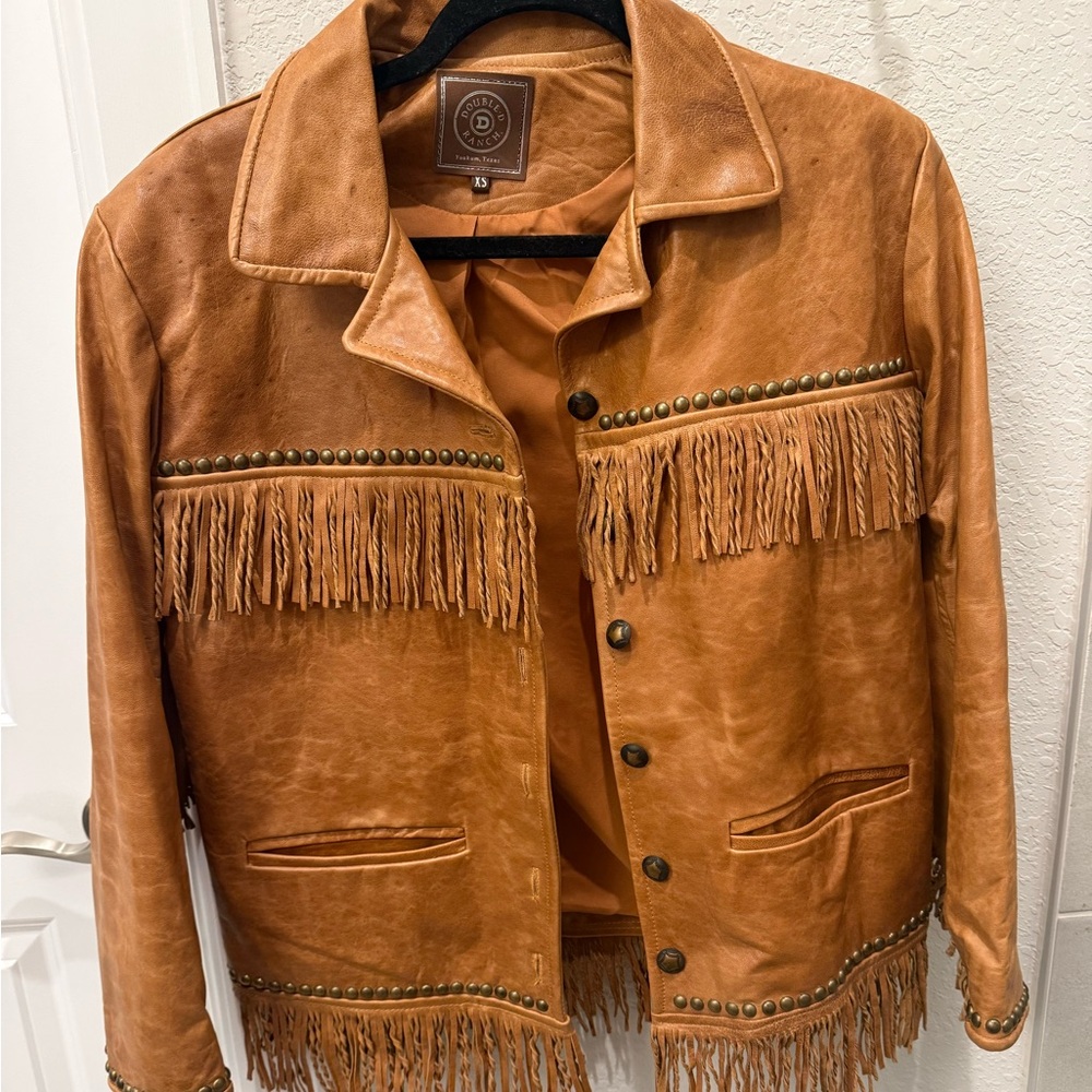 Exquisite like new all leather jacket with fringe trim and studs!